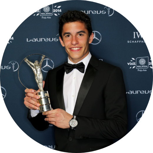 Marc Marquez holding a Laureus World Breakthrough of the Year Award in 2013.