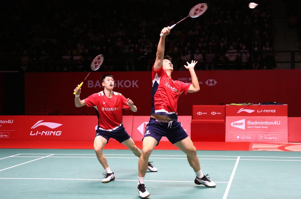 Liu Yuchen/Ou Xuanyi of China compete against Mohammad Ahsan/Hendra Setiawan of Indonesia during the men's doubles final at the BWF World Tour Finals 2022 in Bangkok, Thailand.